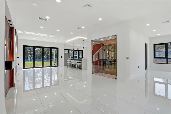 a kitchen with stainless steel appliances granite countertop a refrigerator and a sink