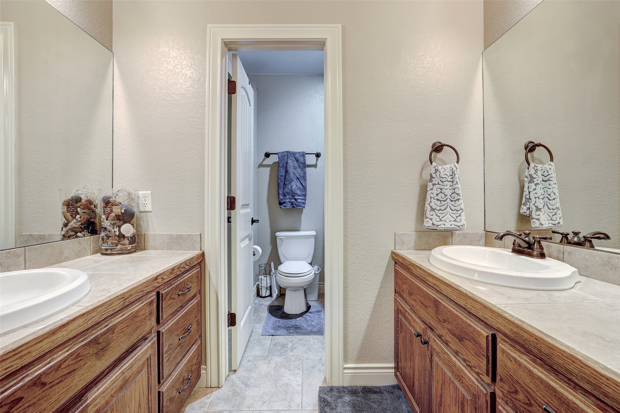 Undisclosed Address Georgetown, TX 78633 - Photo 31 of 39 a bathroom with a sink a toilet and a mirror
