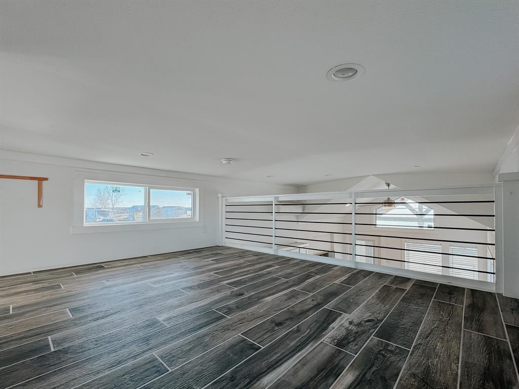 6422 Peninsula Road Kerens, TX 75144 - Photo 9 of 16 a view of empty room with wooden floor