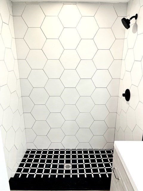 38 Oneida Street, Unit 2 Lynn, MA 01902 - Photo 13 of 22 a bathroom with a black white checkered floor