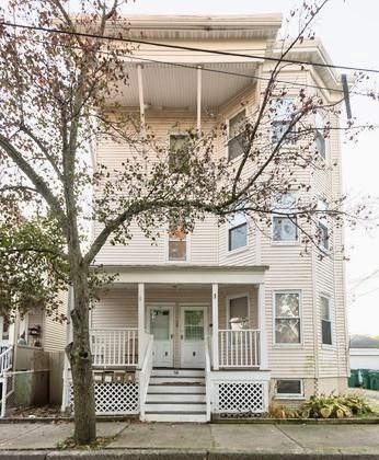 38 Oneida Street, Unit 2 Lynn, MA 01902 - Photo 17 of 22 a view of a white house with a large tree