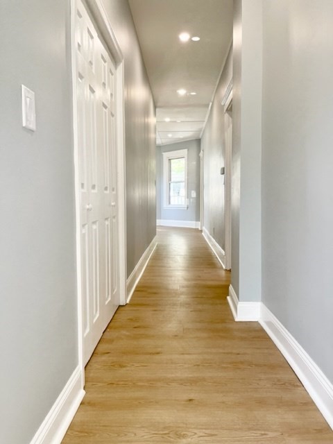 38 Oneida Street, Unit 2 Lynn, MA 01902 - Photo 7 of 22 a view of a hallway with wooden floor