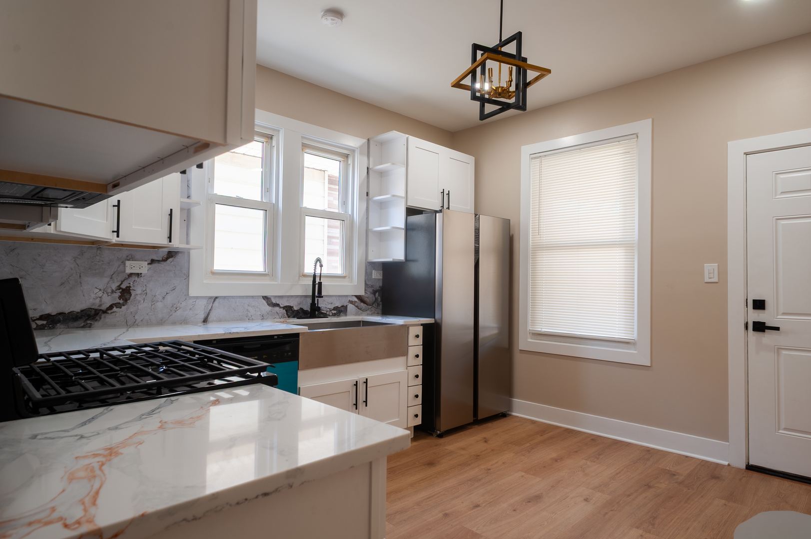 8620 South Union Avenue Chicago, IL 60620 - Photo 19 of 41 a kitchen with stainless steel appliances a stove a refrigerator and a window