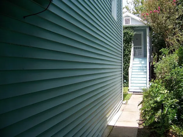 a view of a house with a door and wooden floor