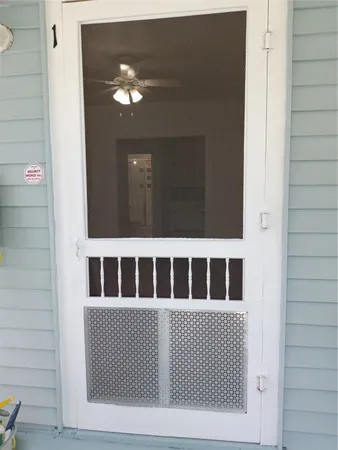 a view of staircase with white walls