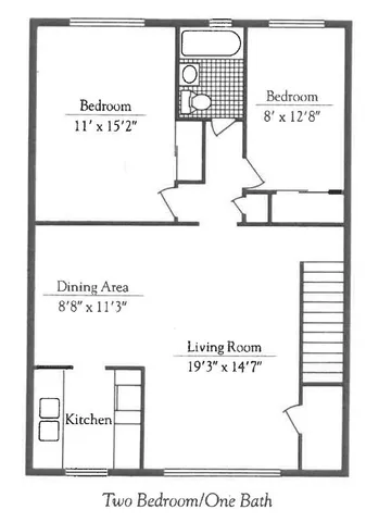a view of a house with a small yard and sitting area