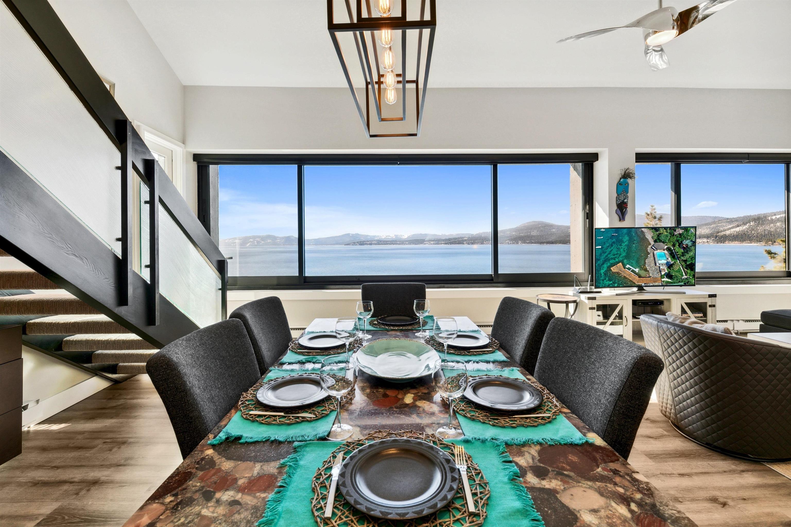 a dining room with furniture and a wooden floor