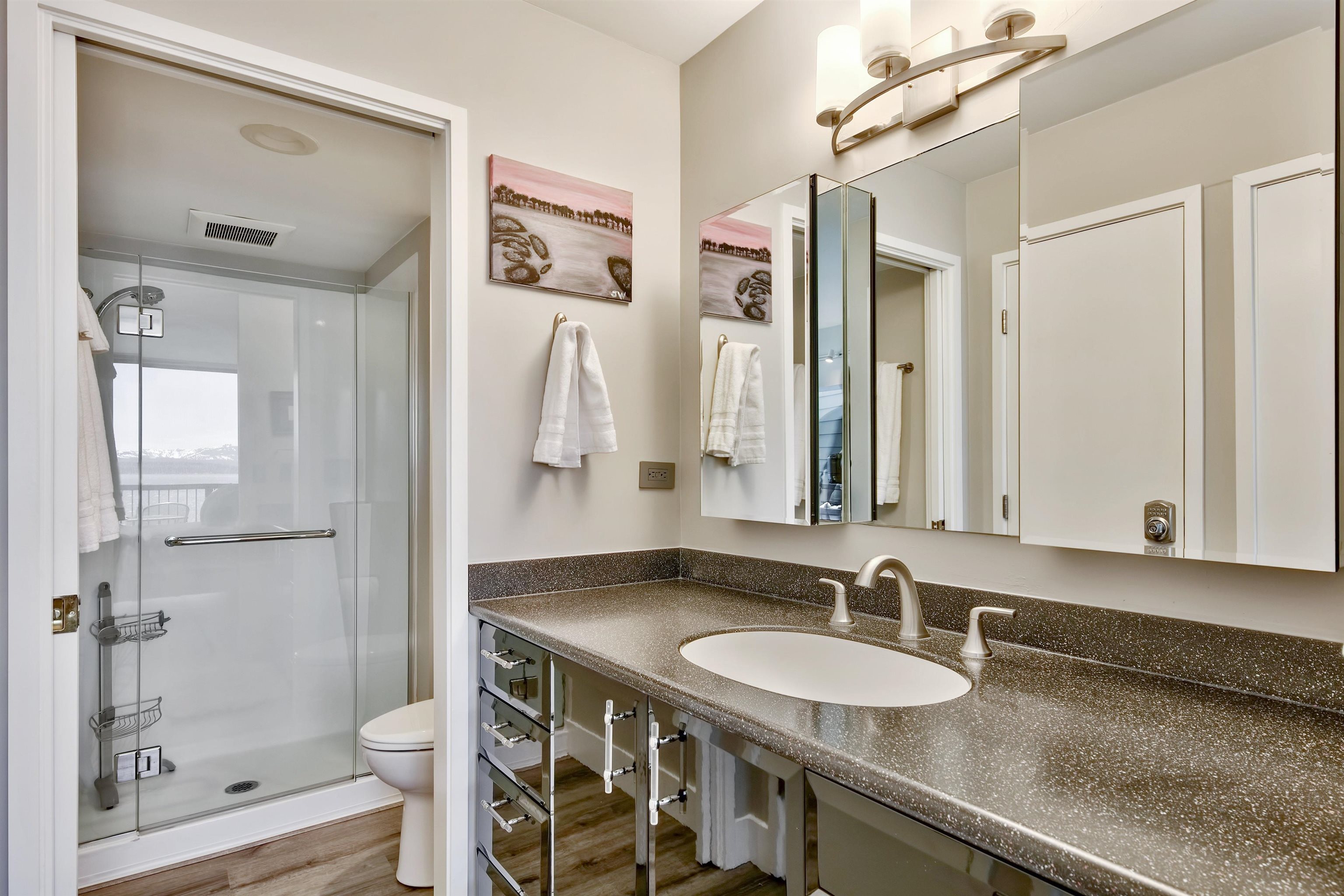 9200 Brockway Springs Drive, Unit 72 Kings Beach, CA 96143 - Photo 12 of 21 a bathroom with a granite countertop sink a toilet and shower