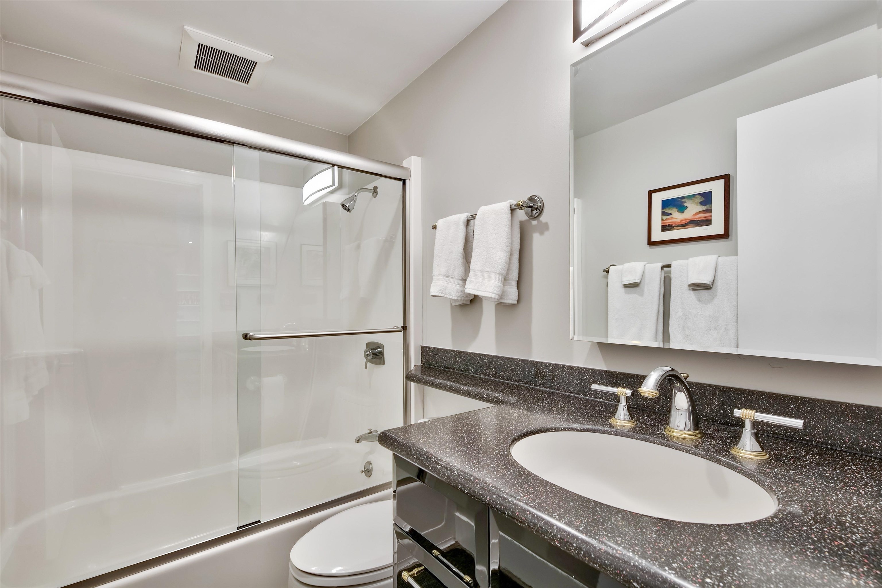 9200 Brockway Springs Drive, Unit 72 Kings Beach, CA 96143 - Photo 14 of 21 a bathroom with a granite countertop sink toilet and shower