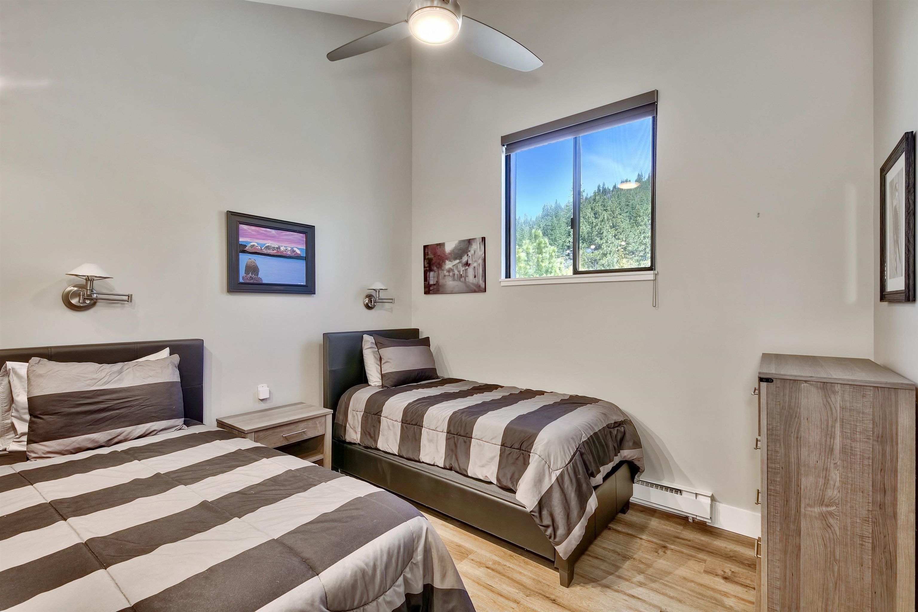 9200 Brockway Springs Drive, Unit 72 Kings Beach, CA 96143 - Photo 16 of 21 a bedroom with a bed and a painting on the wall