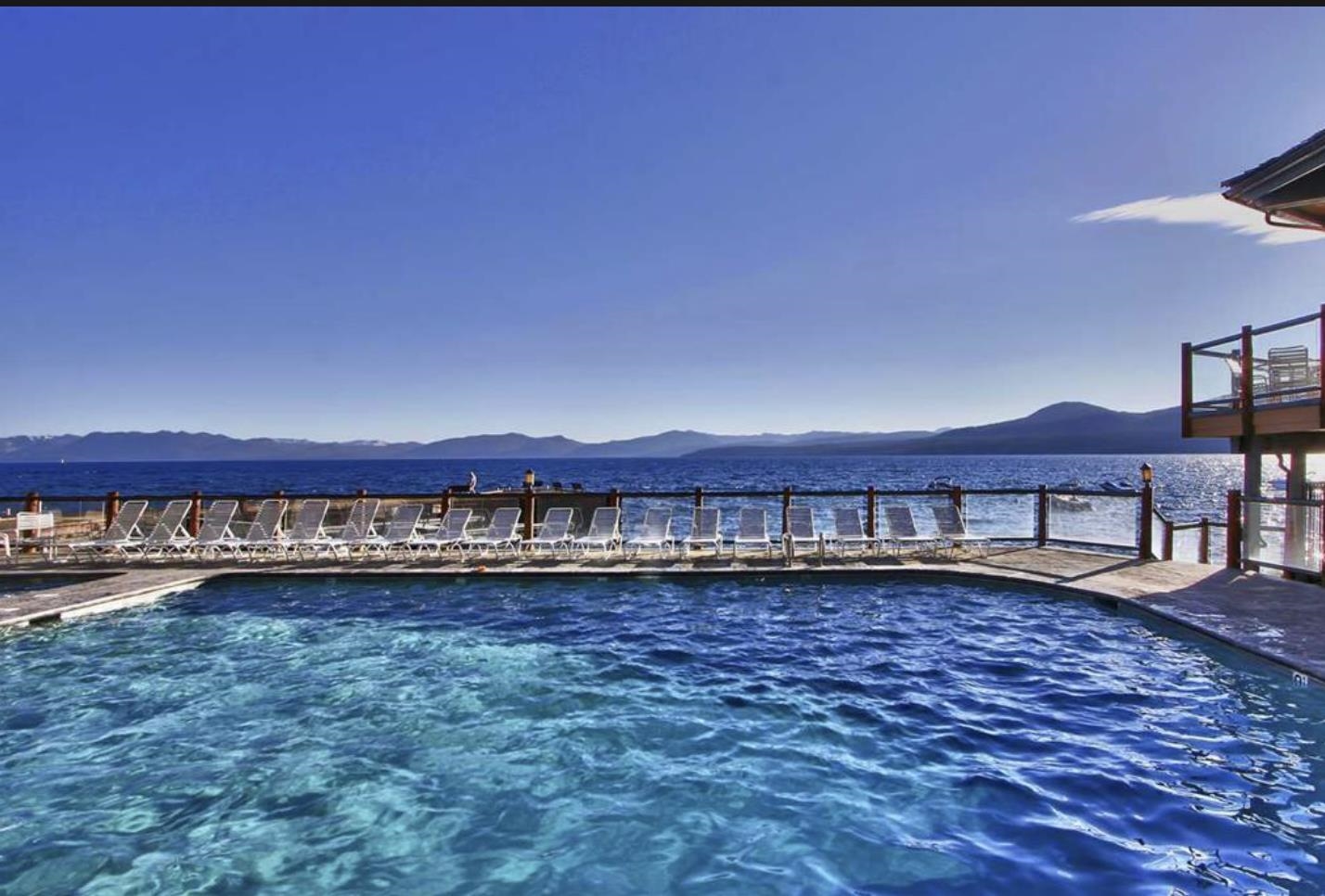 9200 Brockway Springs Drive, Unit 72 Kings Beach, CA 96143 - Photo 19 of 21 a view of a ocean with a big yard and large trees