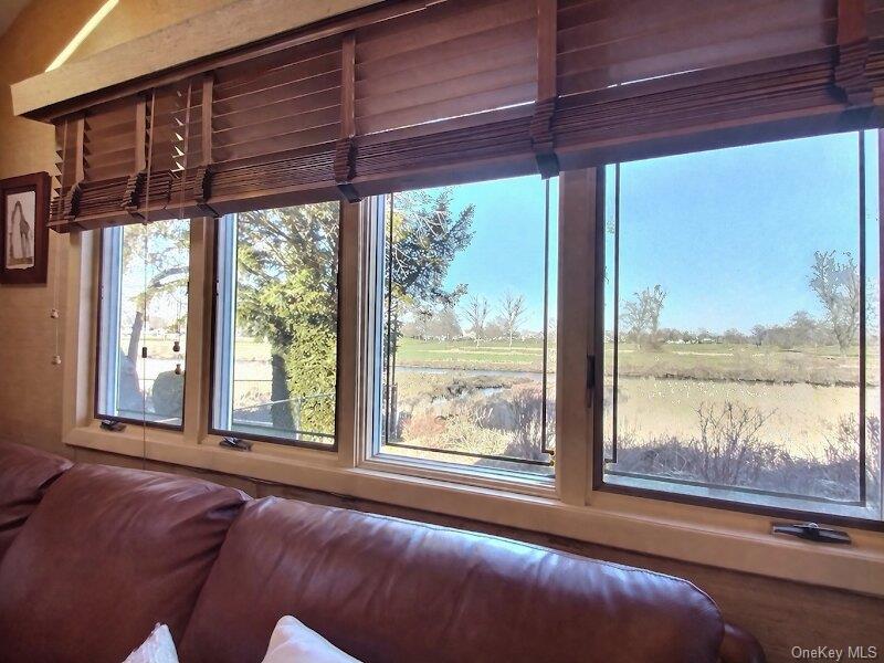 3421 Turf Road Oceanside, NY 11572 - Photo 25 of 50 a room with furniture and large windows