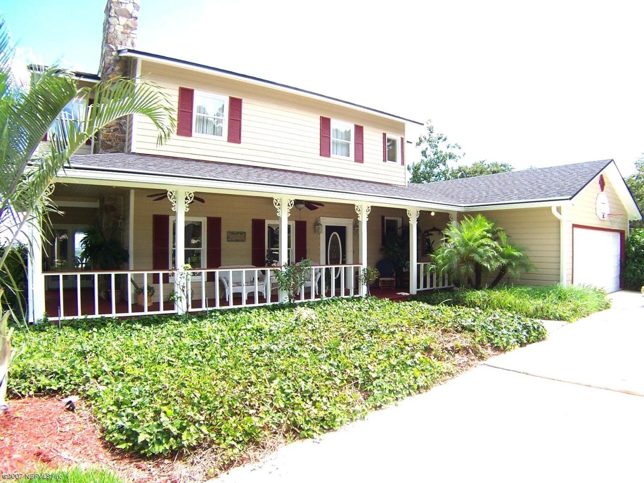 4247 Heath Road Jacksonville, FL 32277 - Photo 3 of 27 a front view of a house with garden