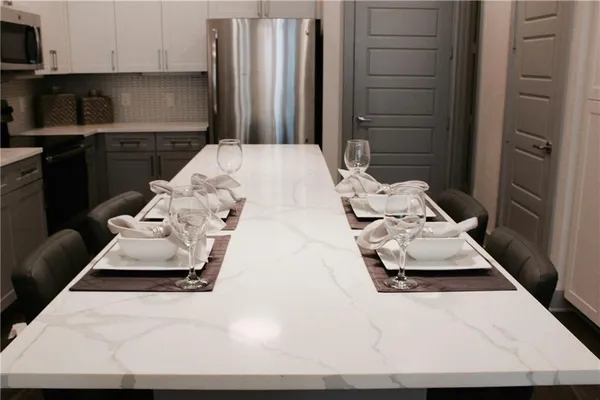 a kitchen with a sink appliances and cabinets
