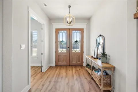 a view of entryway with wooden floor