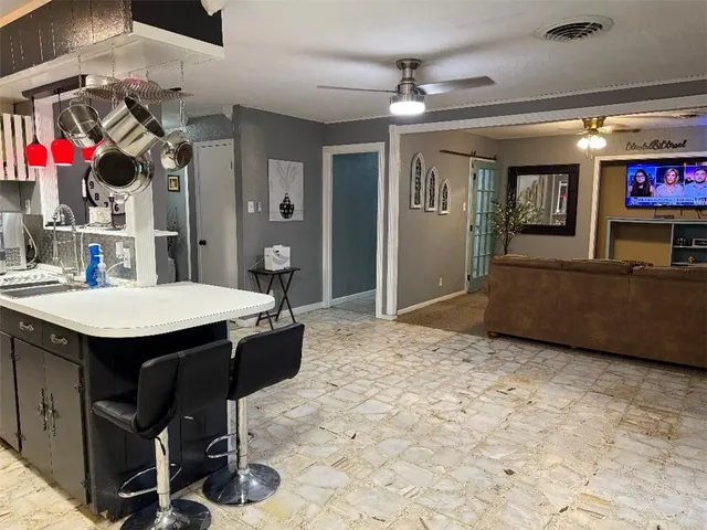 a view of kitchen island with furniture and window