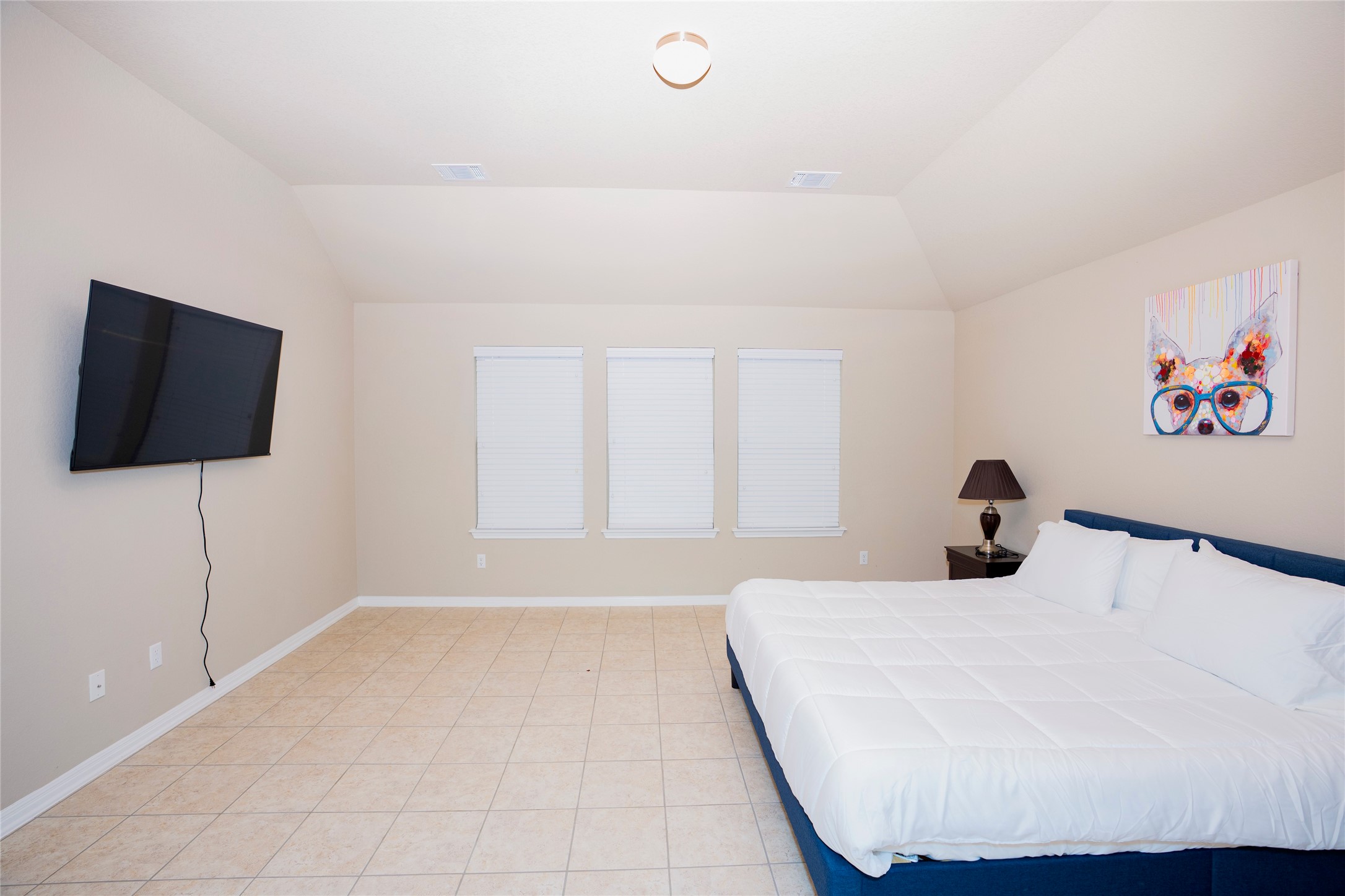 20916 Carries Ranch Road Pflugerville, TX 78660 - Photo 21 of 40 a bedroom with a bed and a flat screen tv