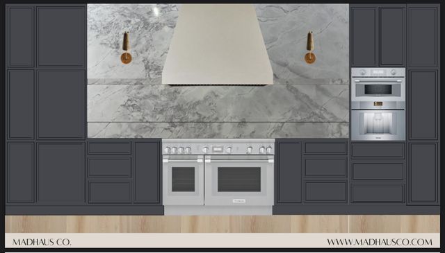 a kitchen with stainless steel appliances granite countertop a stove and a microwave