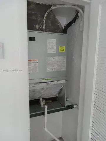 a white toilet sitting next to a bath tub