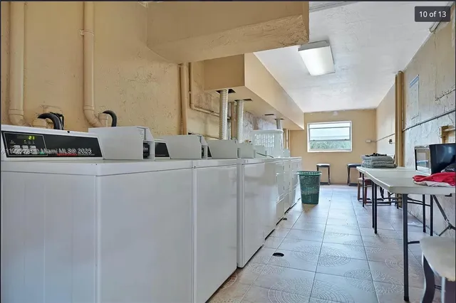 a kitchen with a sink and a refrigerator