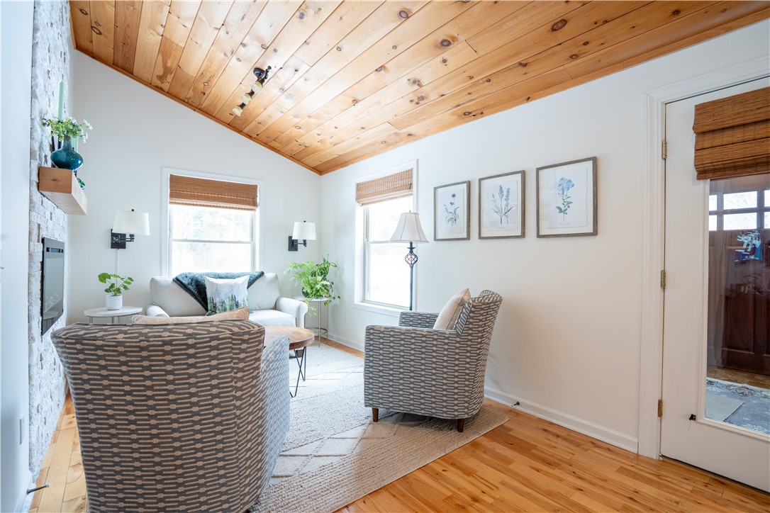 595 Lake Road Webster, NY 14580 - Photo 12 of 49 Vaulted ceiling runs from this sitting area into t