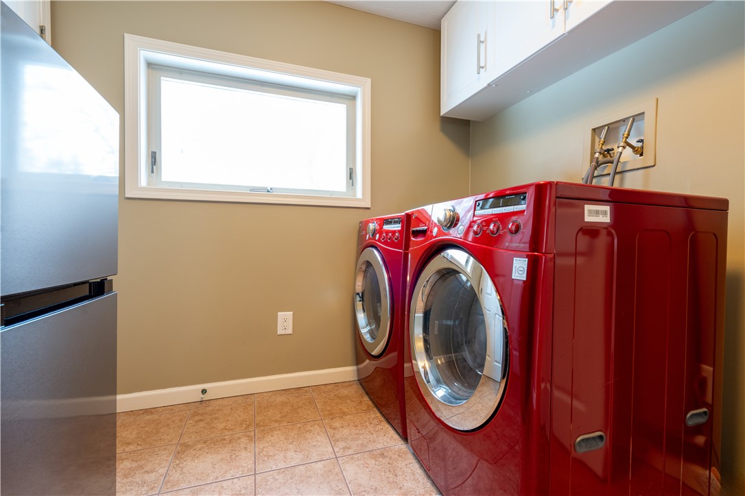 595 Lake Road Webster, NY 14580 - Photo 25 of 49 First floor laundry - high efficiency washer & dry
