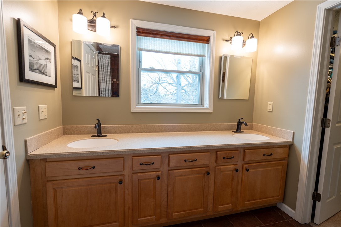 595 Lake Road Webster, NY 14580 - Photo 30 of 49 Primary bedroom double sink vanity area