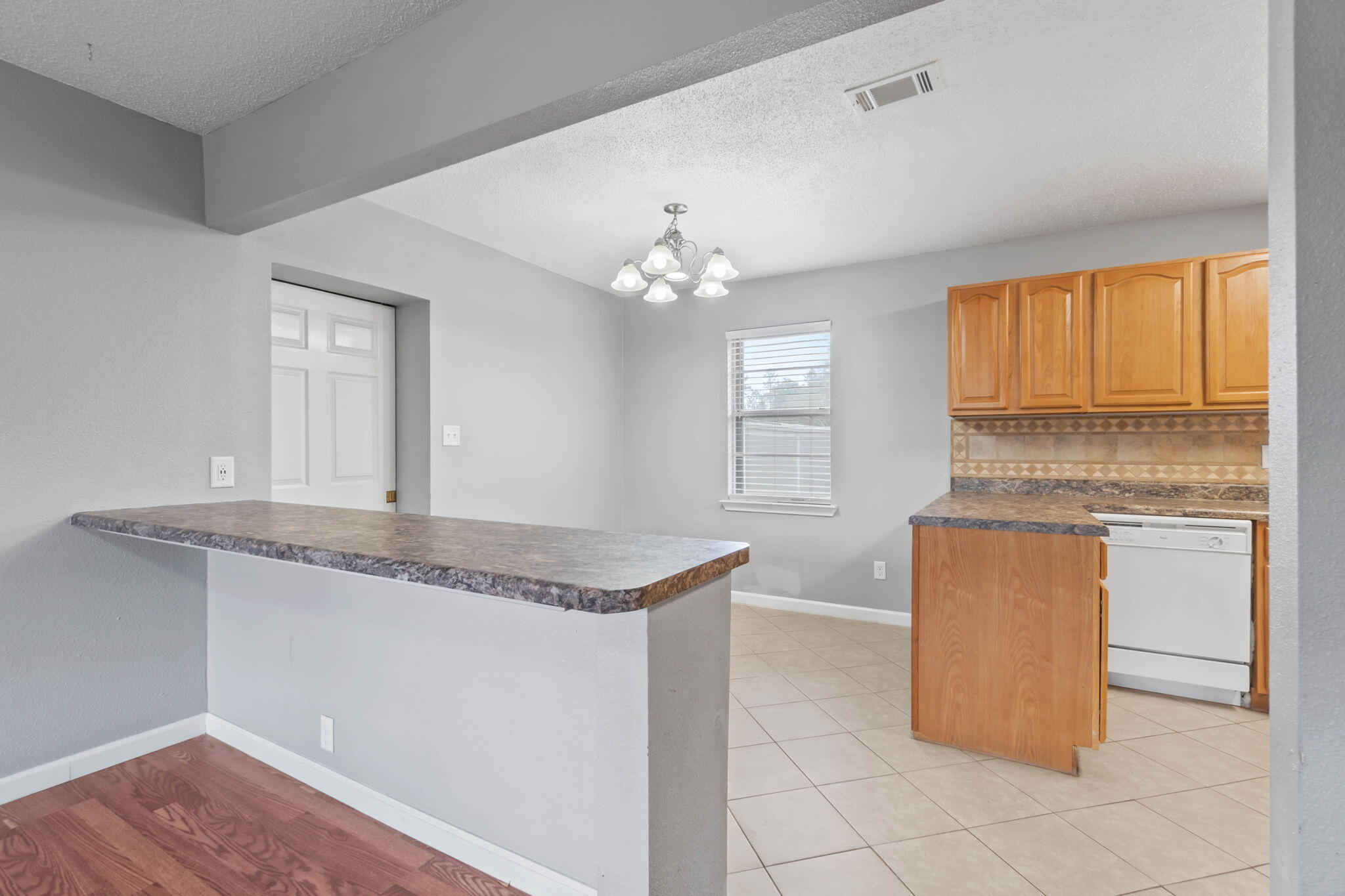 3545 Poverty Creek Road Crestview, FL 32539 - Photo 13 of 33 a kitchen with granite countertop cabinets and window