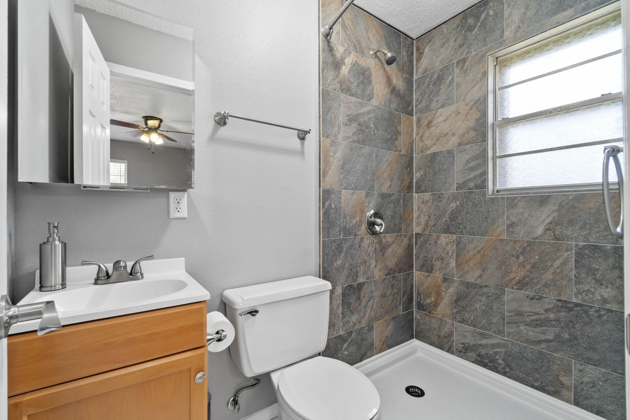 3545 Poverty Creek Road Crestview, FL 32539 - Photo 22 of 33 a bathroom with a sink a toilet and shower