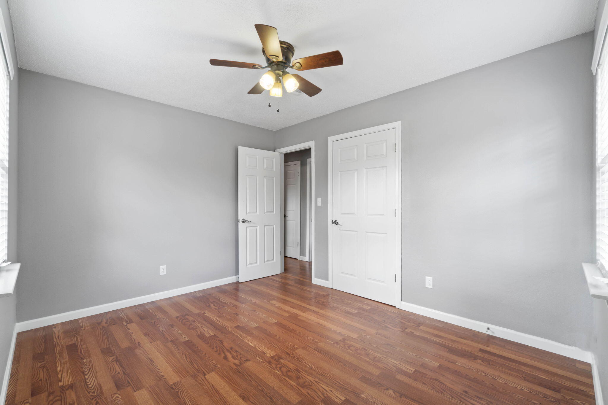 3545 Poverty Creek Road Crestview, FL 32539 - Photo 24 of 33 a view of an empty room with wooden floor