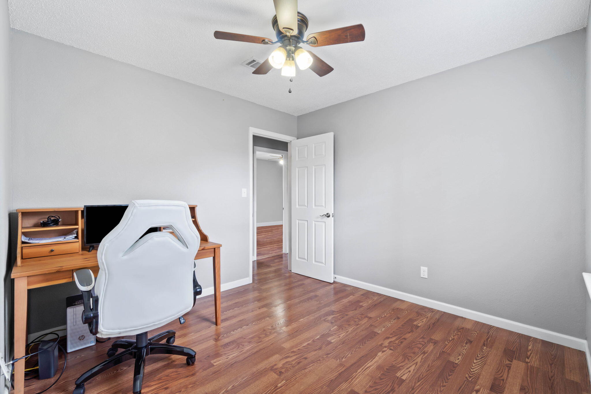 3545 Poverty Creek Road Crestview, FL 32539 - Photo 26 of 33 a view of a workspace with furniture and a chandelier fan