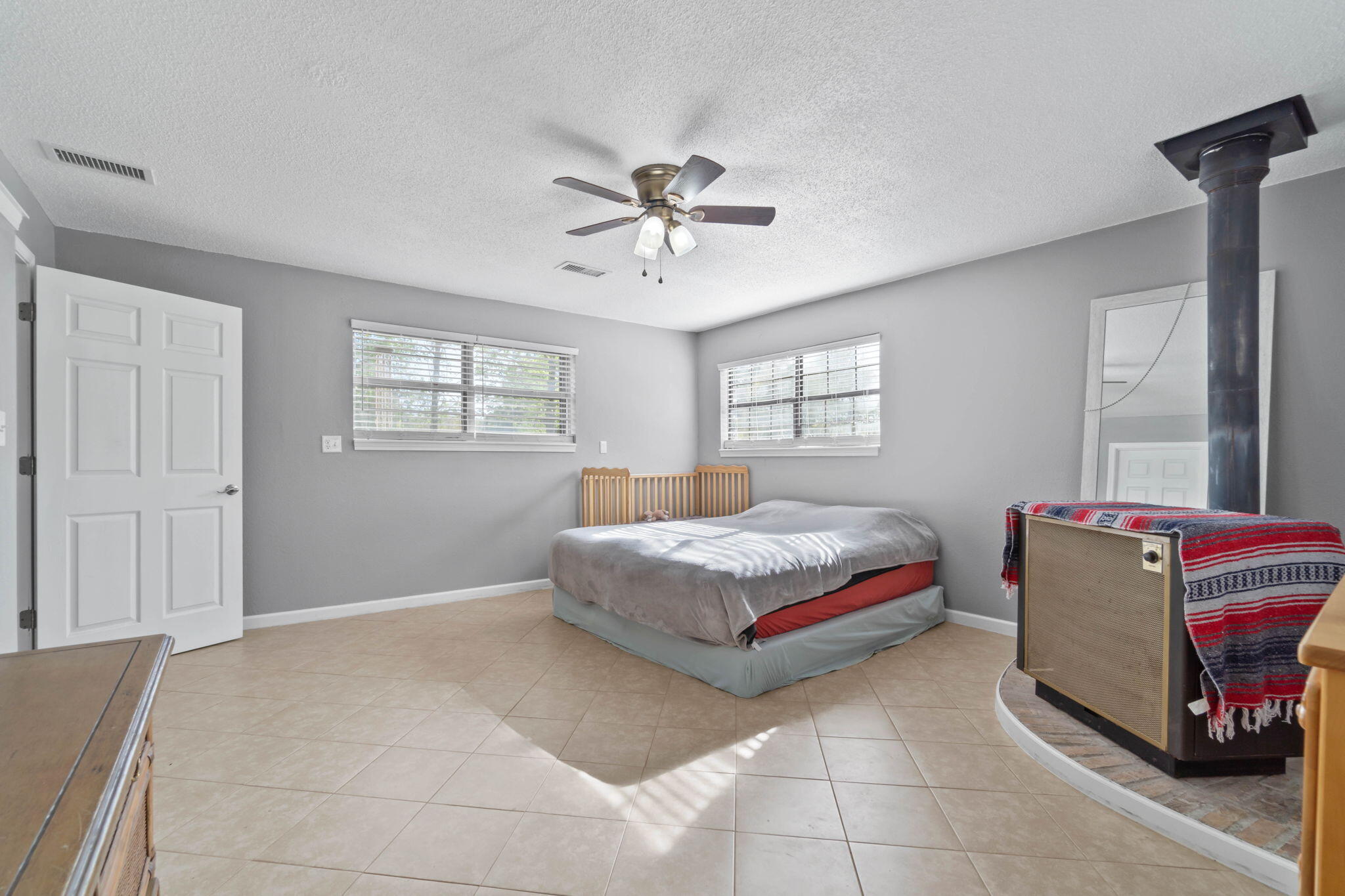 3545 Poverty Creek Road Crestview, FL 32539 - Photo 30 of 33 a bedroom with a bed and window