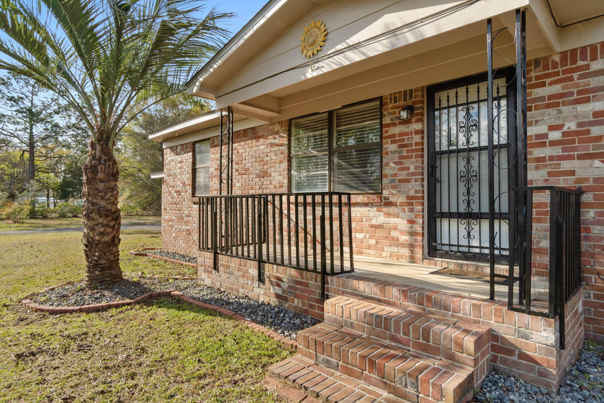 3545 Poverty Creek Road Crestview, FL 32539 - Photo 5 of 33 a view of a house with a floor to ceiling window and wooden fence