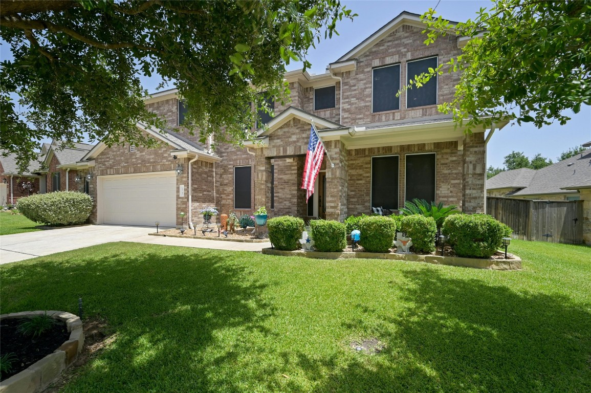 2925 Magellan Way Round Rock, TX 78665 - Photo 1 of 1 a front view of a house with a yard and garage
