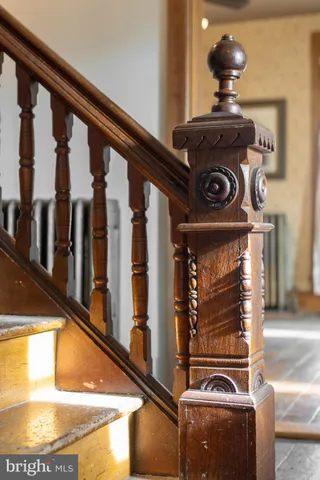 a view of a room with wooden floor and door