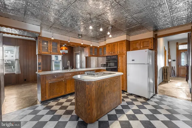 a bathroom with a sink a vanity and a mirror