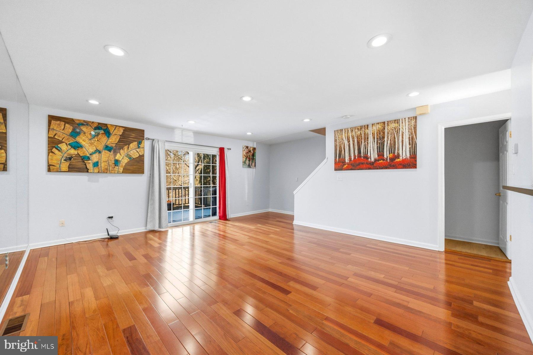 58 Hardwood Drive Rosedale, MD 21237 - Photo 13 of 38 Spacious living area with elegant hardwood floors.