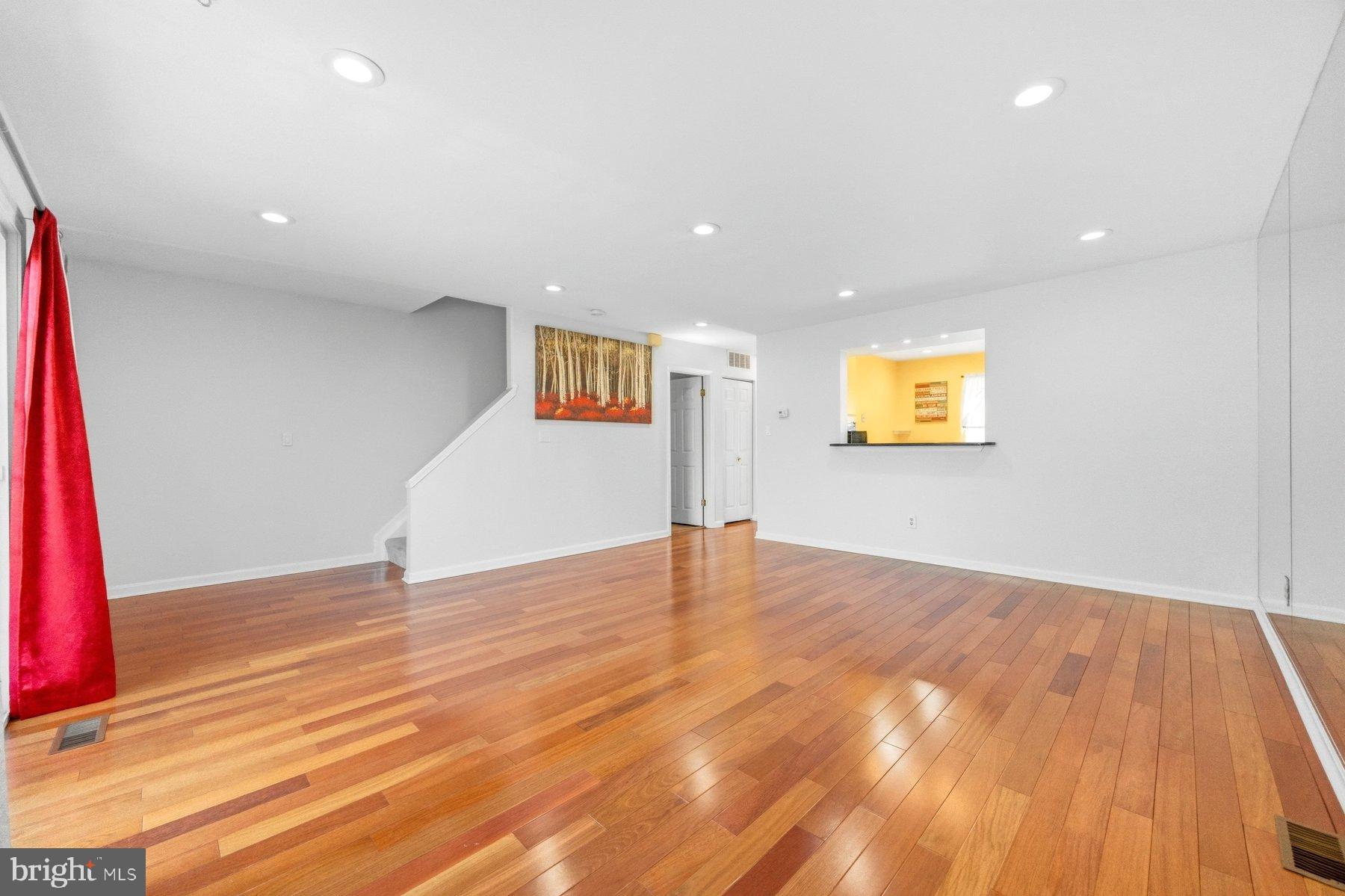 58 Hardwood Drive Rosedale, MD 21237 - Photo 14 of 38 Spacious living area with warm wood floors.