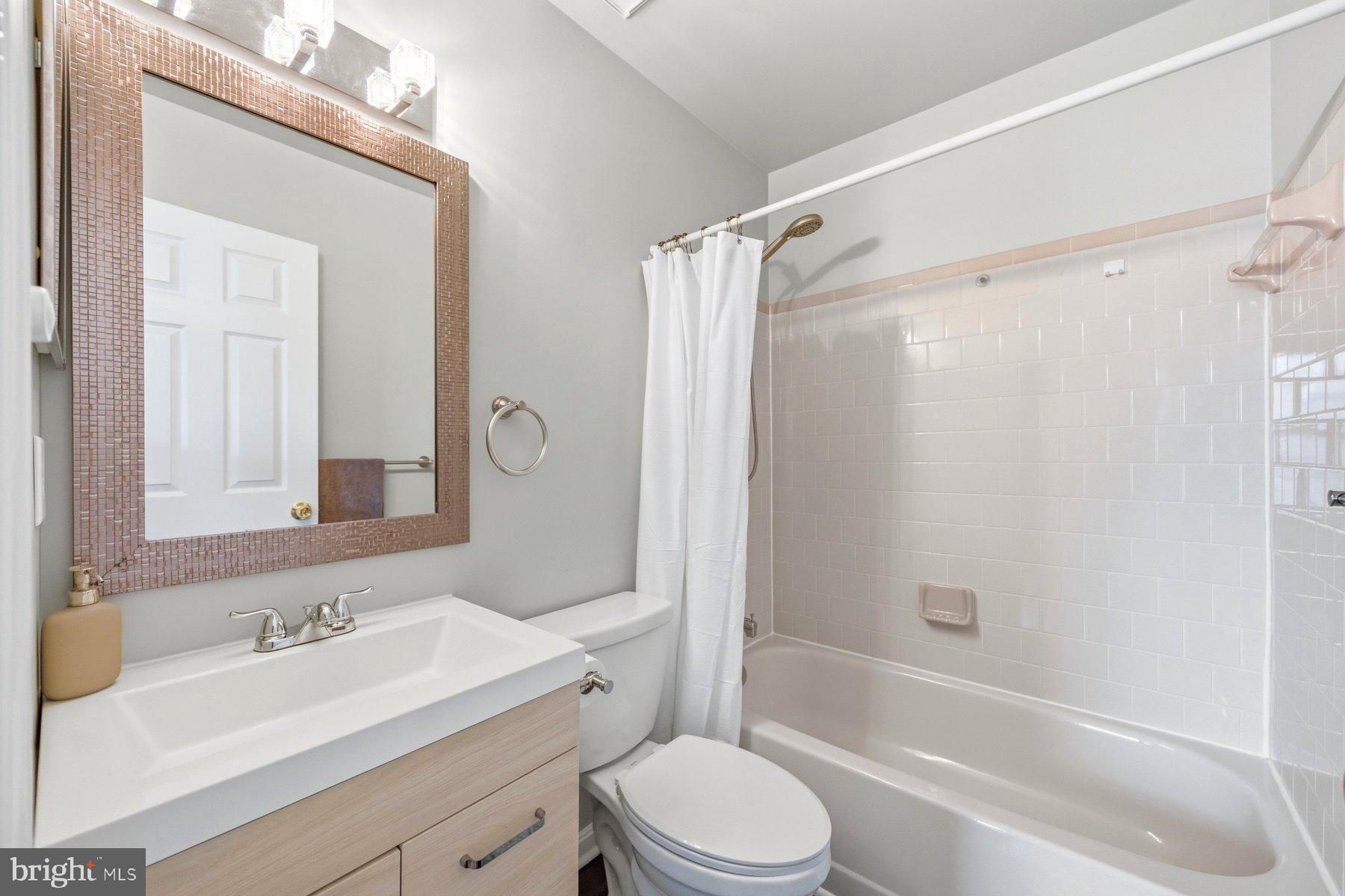 58 Hardwood Drive Rosedale, MD 21237 - Photo 22 of 38 Modern primary bathroom with elegant finishes.