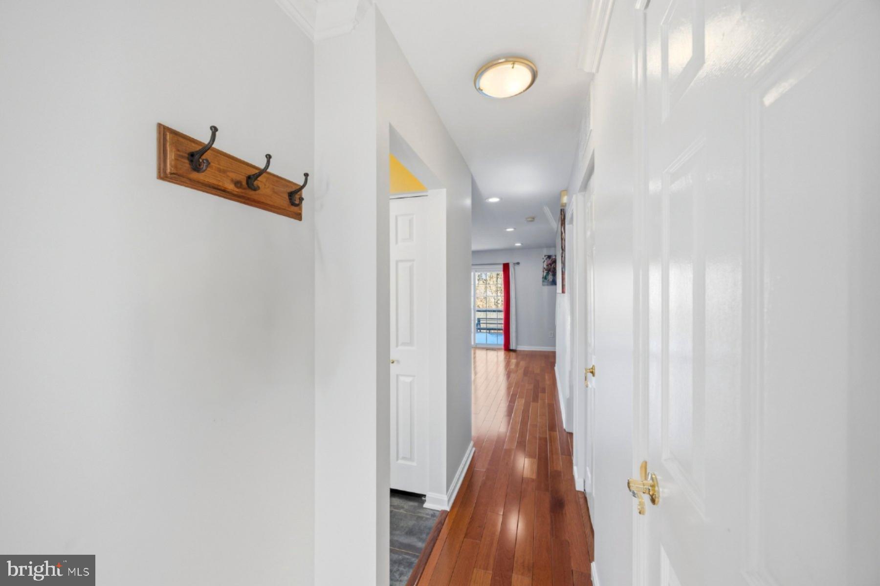 58 Hardwood Drive Rosedale, MD 21237 - Photo 3 of 38 Inviting hallway with warm wooden floors.