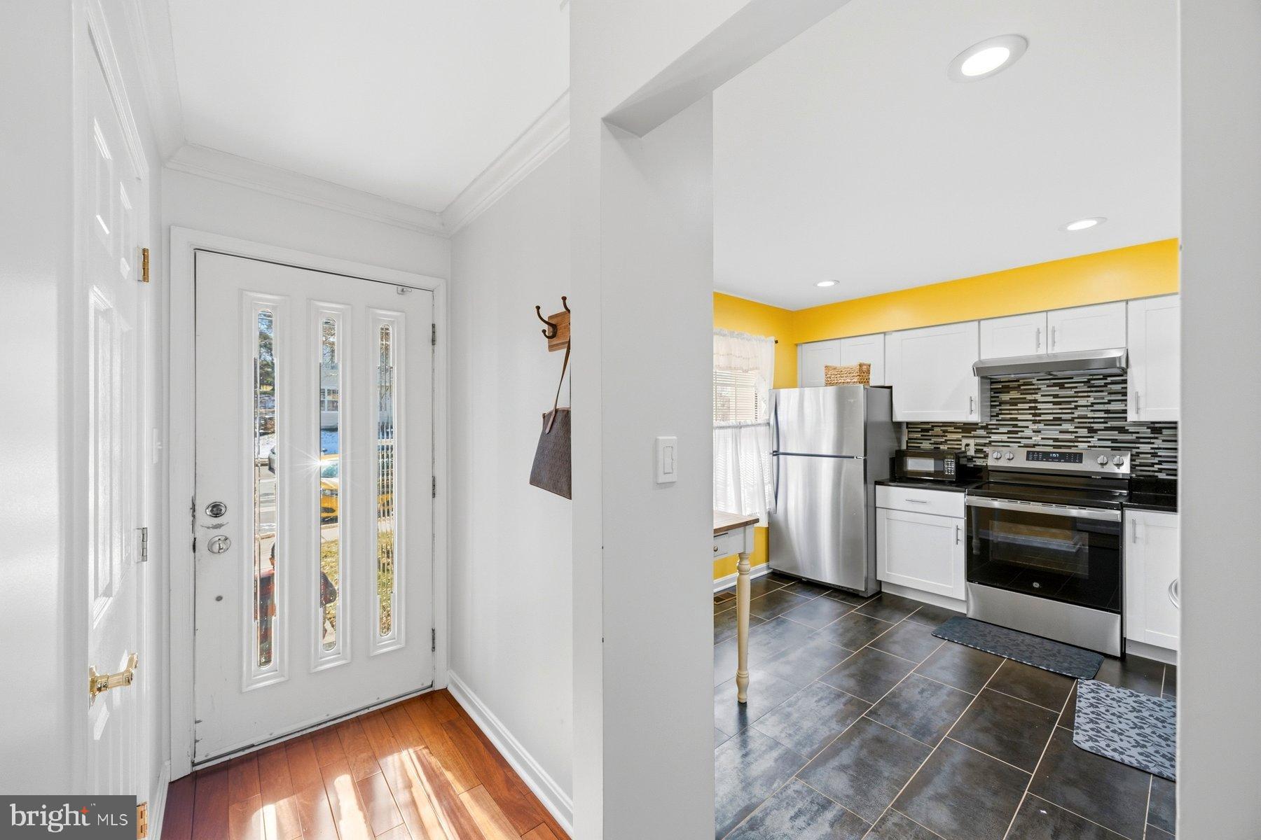 58 Hardwood Drive Rosedale, MD 21237 - Photo 4 of 38 Bright and inviting entryway to modern kitchen.