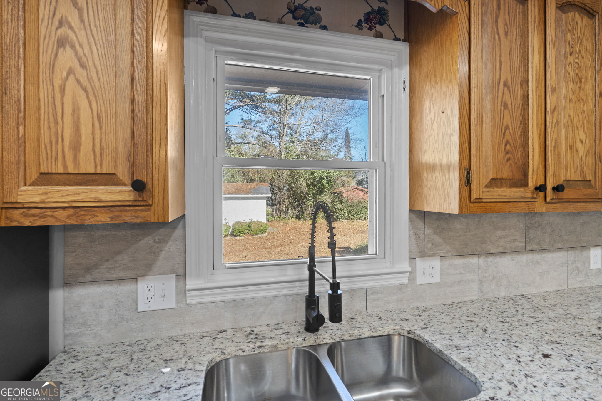 1729 Milton Way Perry, GA 31069 - Photo 18 of 41 a kitchen with granite countertop a sink and a window