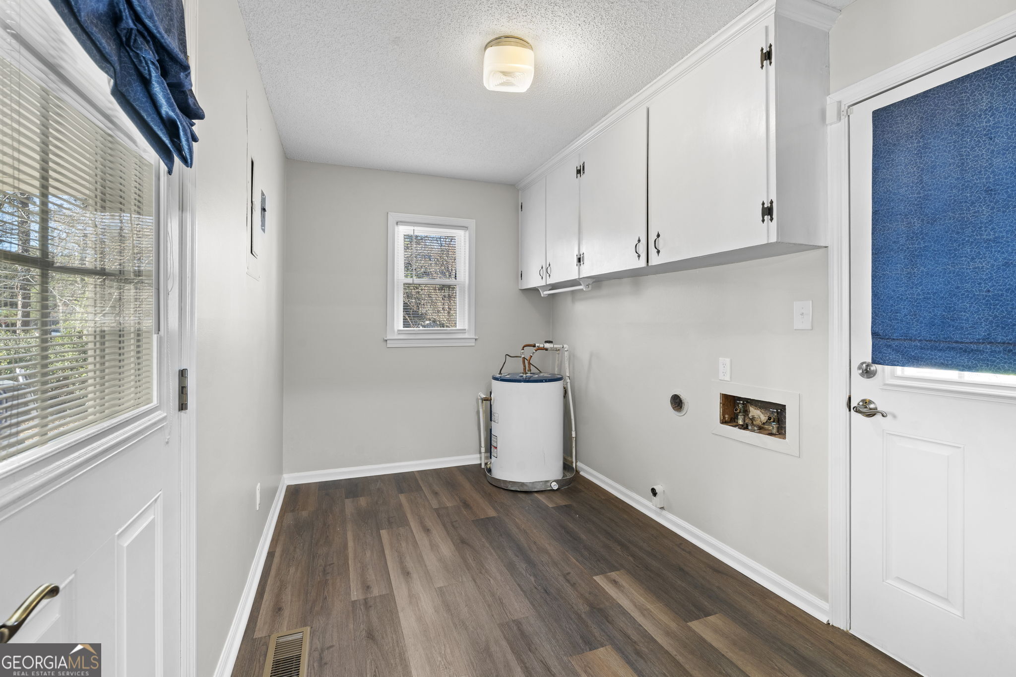 1729 Milton Way Perry, GA 31069 - Photo 21 of 41 a view of a kitchen with wooden floor and electronic appliances