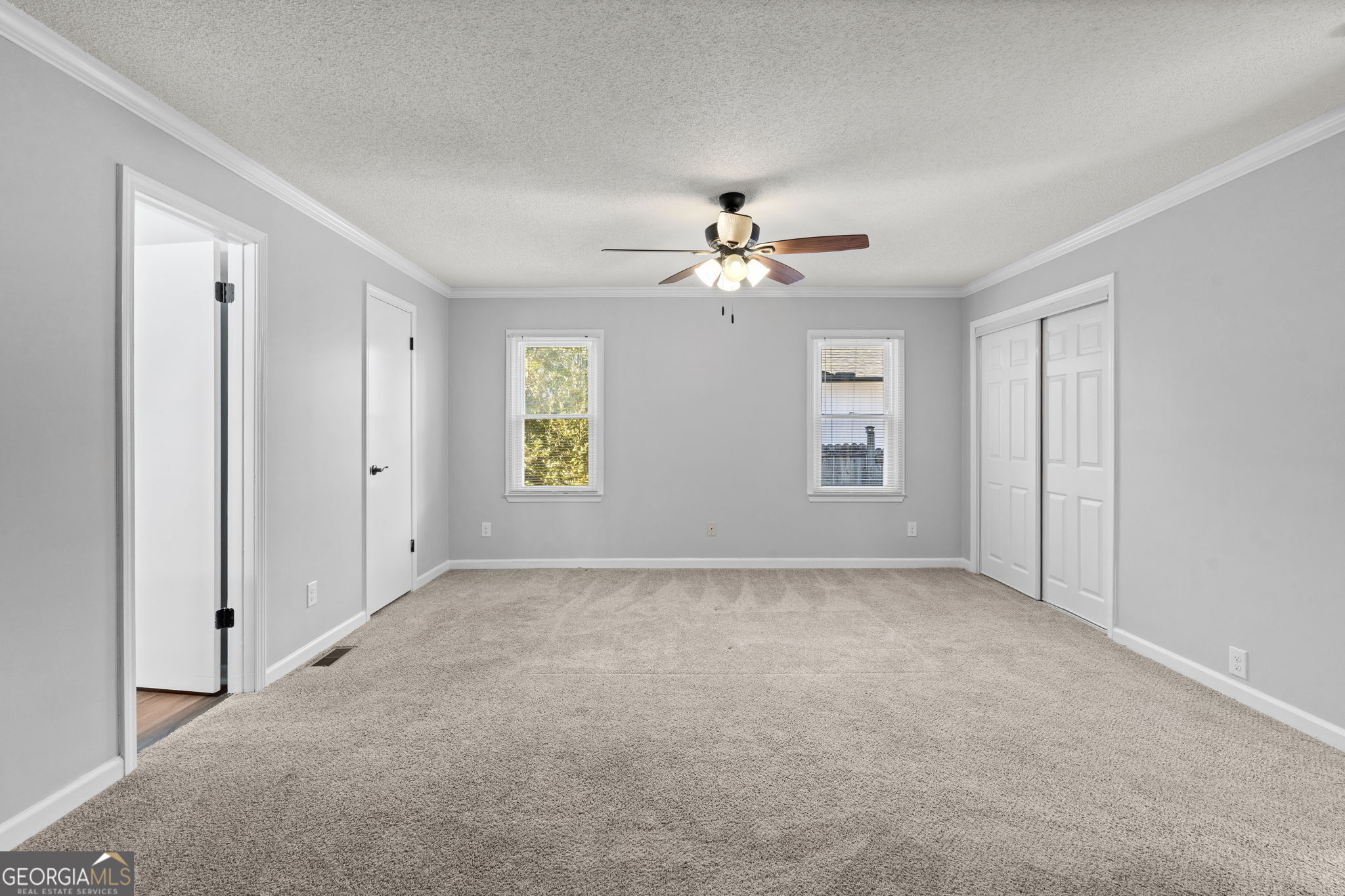 1729 Milton Way Perry, GA 31069 - Photo 23 of 41 a view of an empty room with a ceiling fan