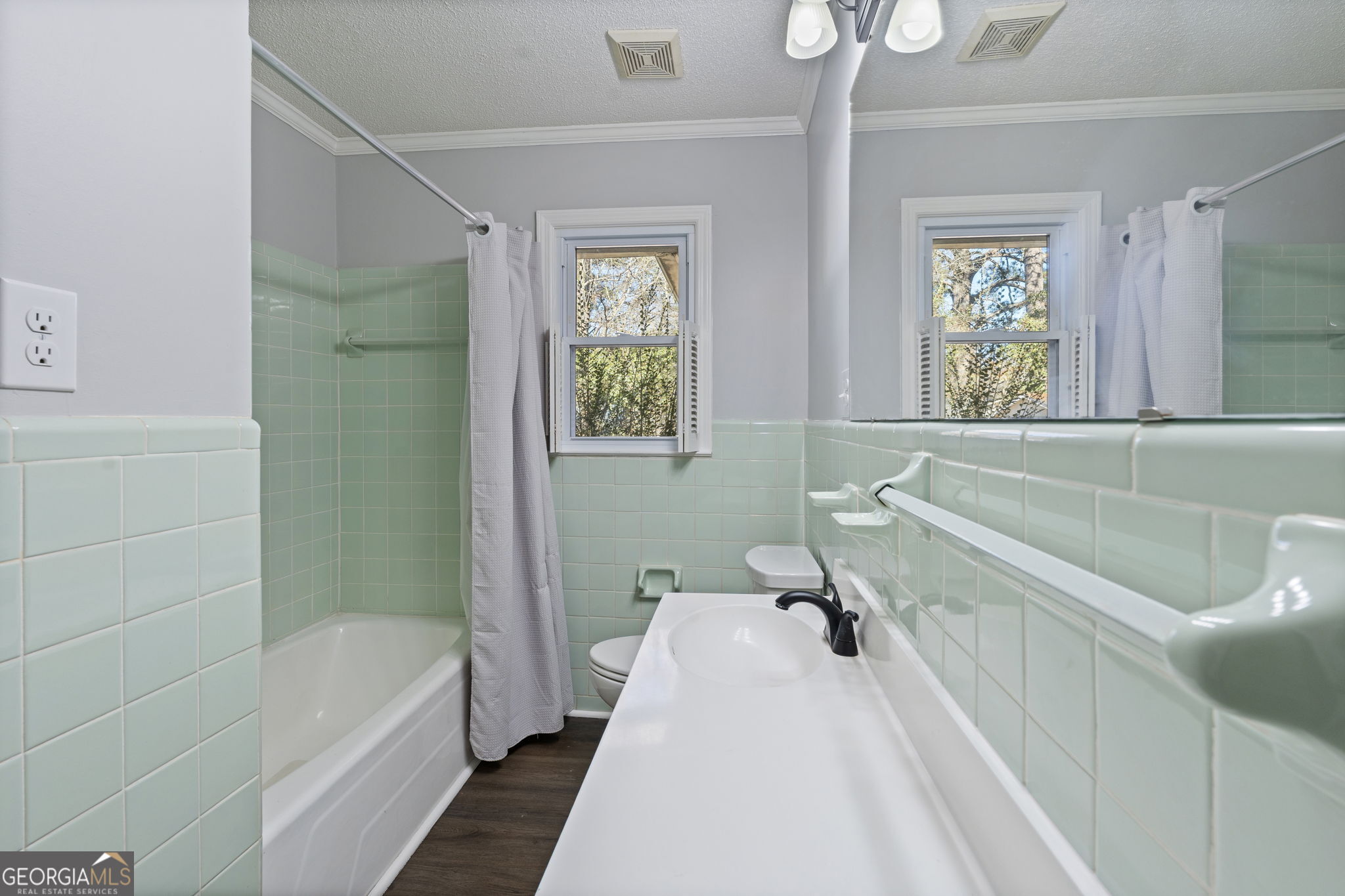 1729 Milton Way Perry, GA 31069 - Photo 25 of 41 a bathroom with a bathtub a window and a shower