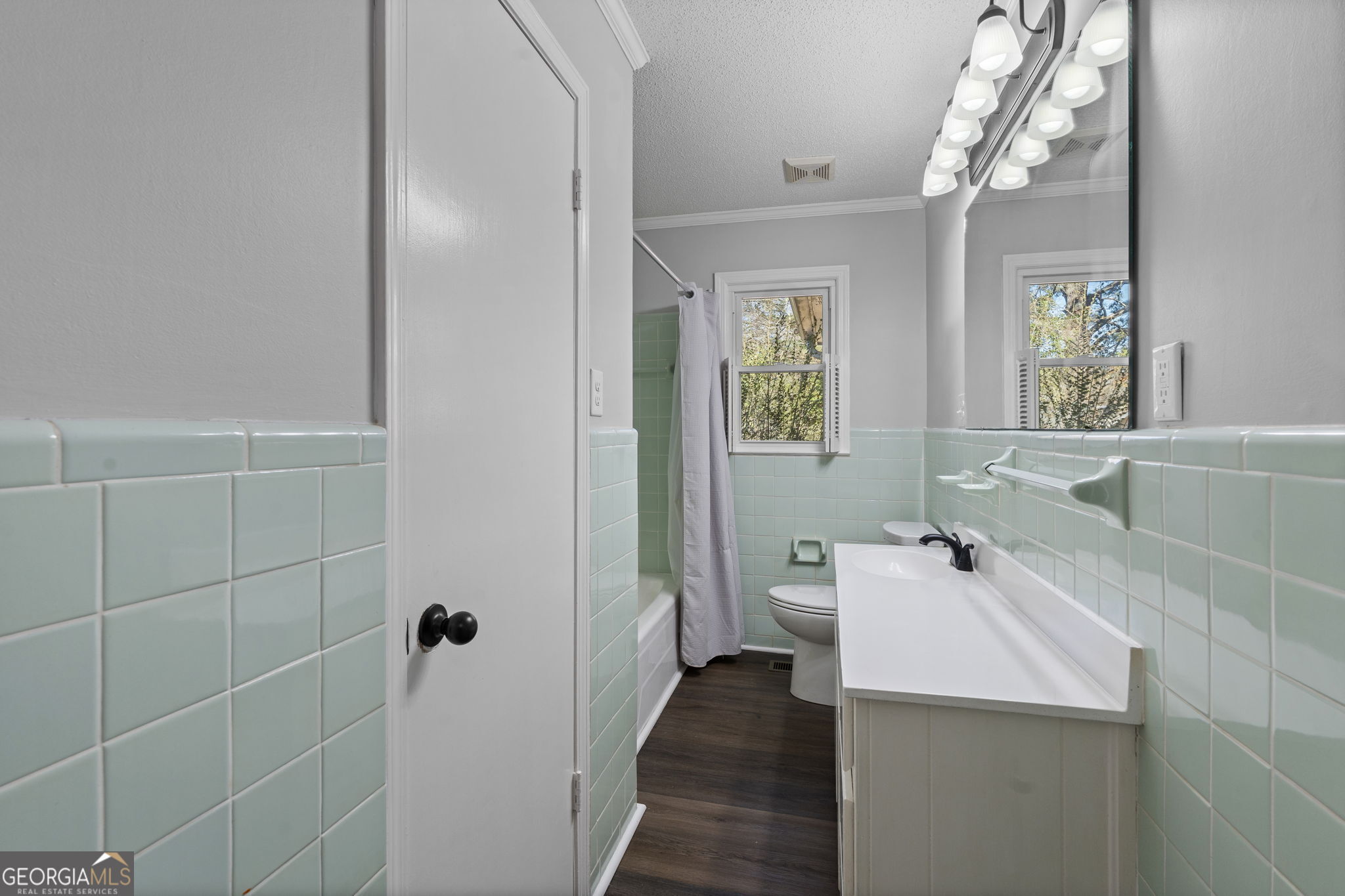 1729 Milton Way Perry, GA 31069 - Photo 26 of 41 a bathroom with a sink a toilet and shower