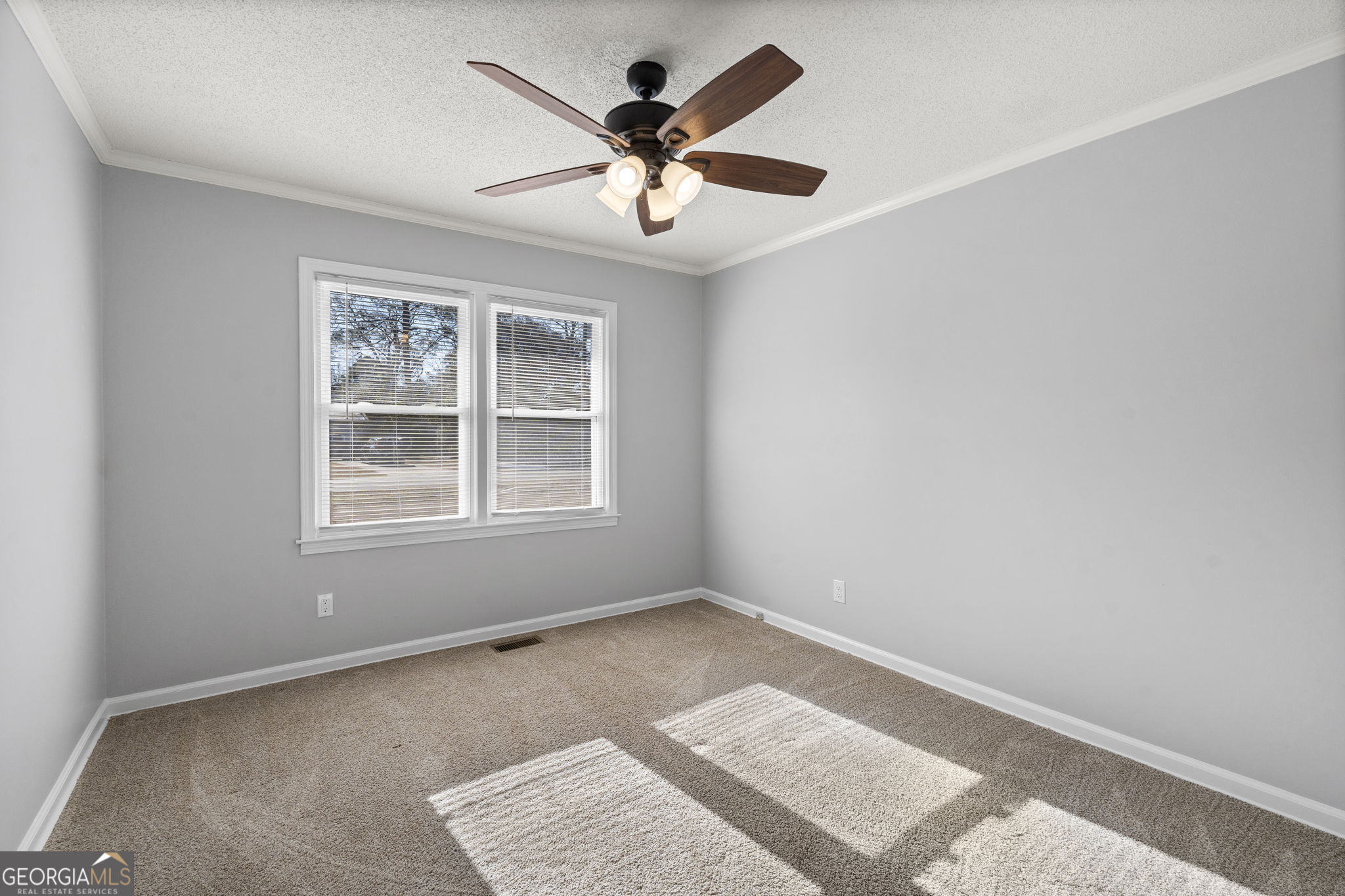 1729 Milton Way Perry, GA 31069 - Photo 29 of 41 an empty room with ceiling fan and windows