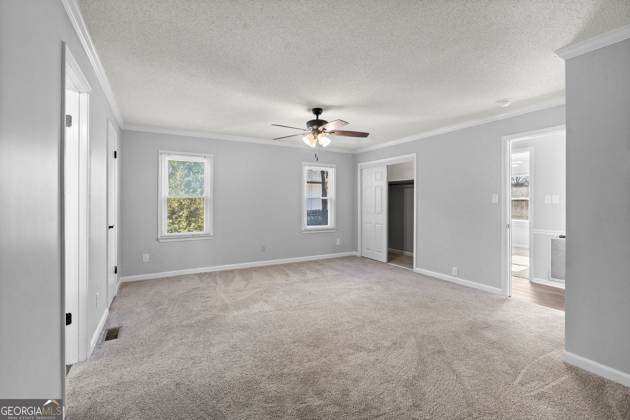 1729 Milton Way Perry, GA 31069 - Photo 30 of 41 an empty room with fan and windows