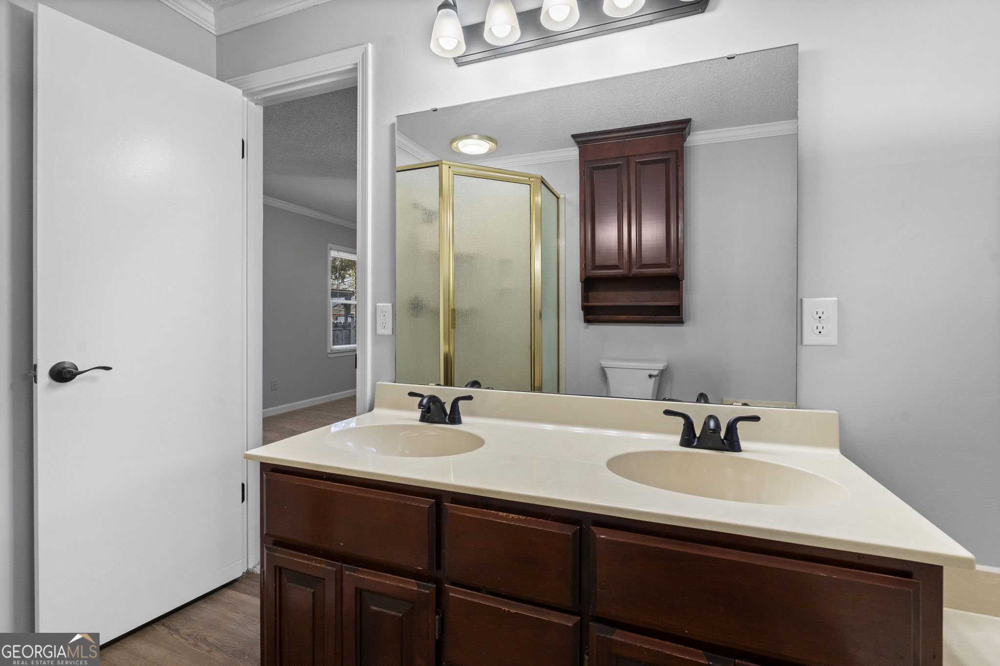 1729 Milton Way Perry, GA 31069 - Photo 34 of 41 a bathroom with a sink and a mirror