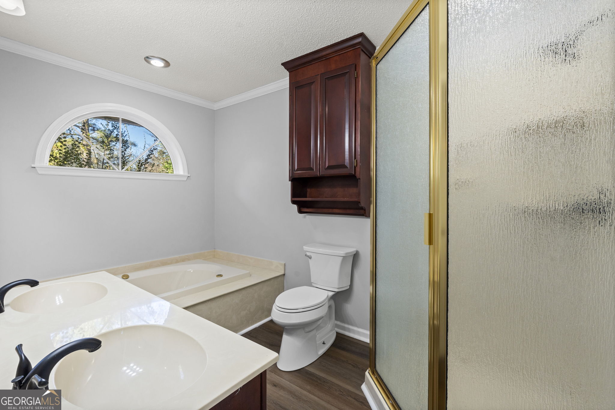 1729 Milton Way Perry, GA 31069 - Photo 35 of 41 a bathroom with a toilet a sink and a mirror